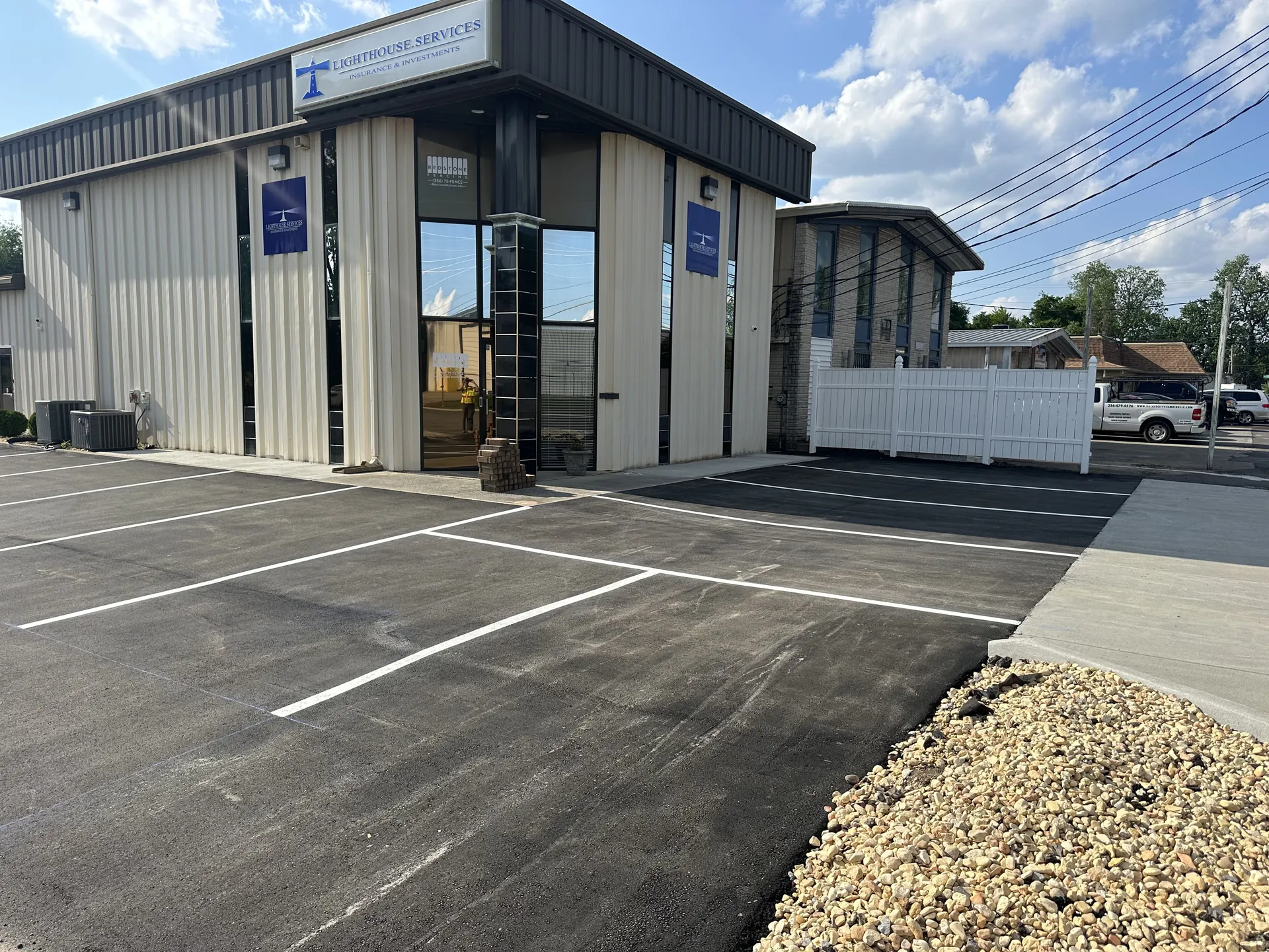 Freshly striped commercial parking lot at Lighthouse Services maintained by Project One Contracting in North Alabama