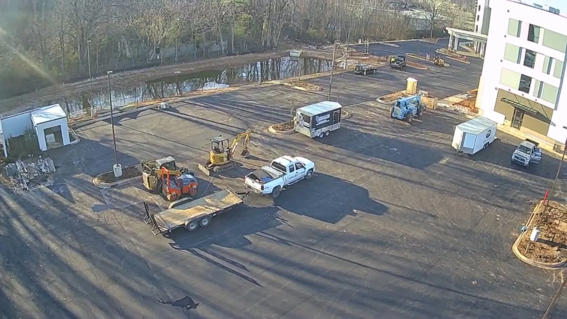 Aerial view of a freshly paved asphalt parking lot at a North Alabama apartment community