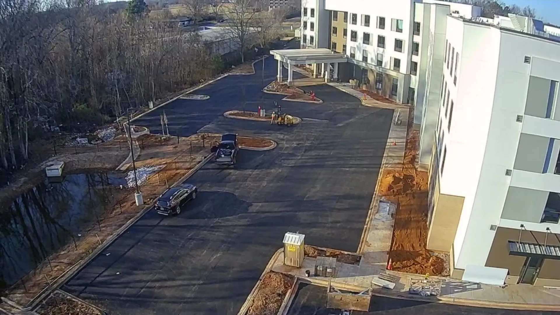 Aerial of a paved apartment community with pool deck in North Alabama