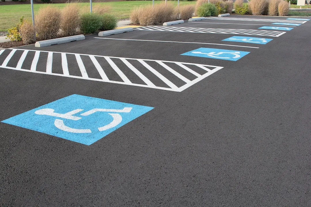 Freshly painted ADA-compliant handicap parking stall with access aisle
