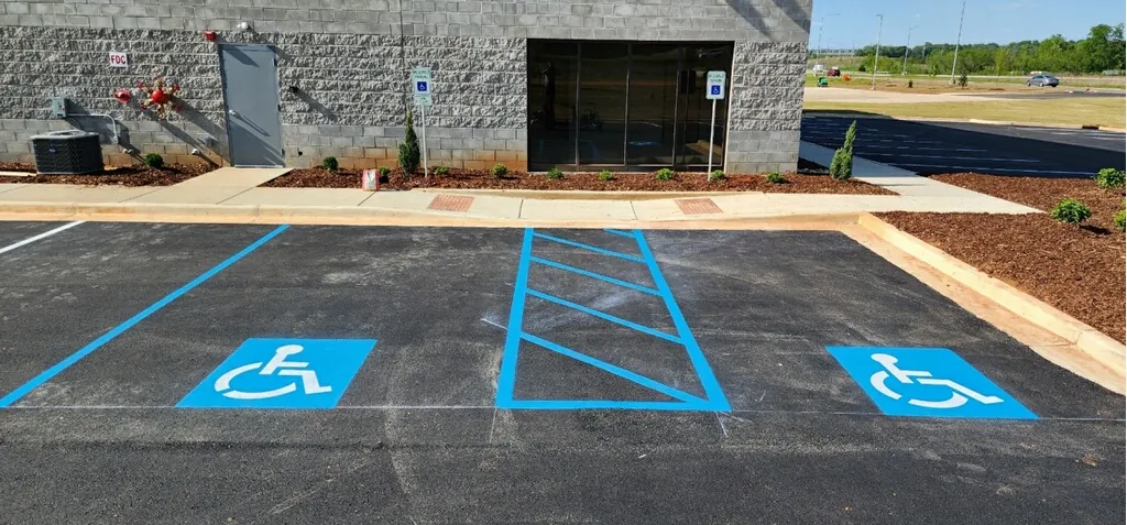 Freshly painted ADA-compliant accessible parking stalls with access aisle