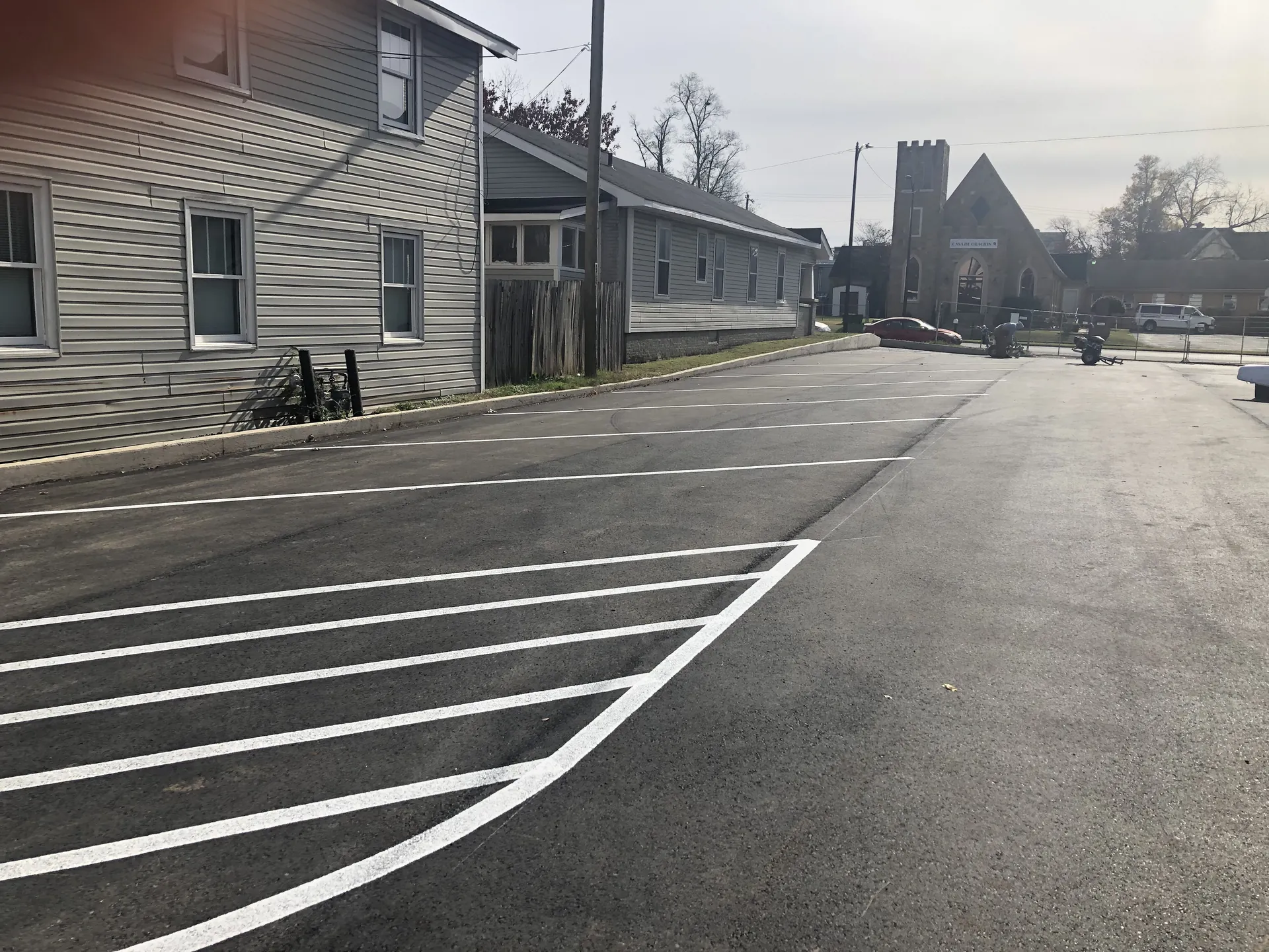 Freshly painted standard parking lot striping by Project One Contracting